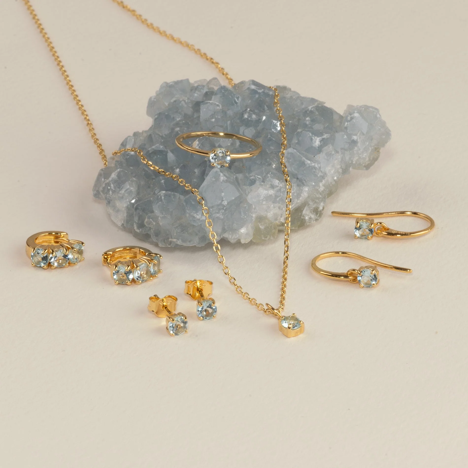 GEMMA BLUE TOPAZ GOLDEN HUGGIE EARRING - Image 6