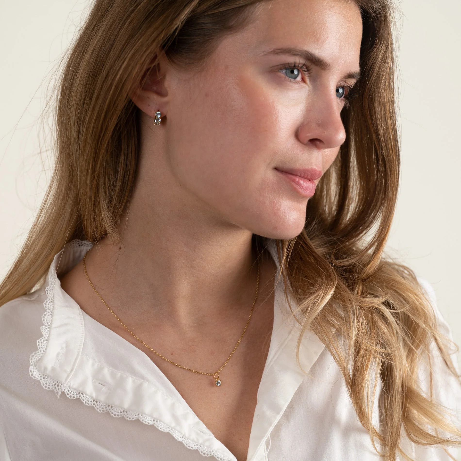 GEMMA BLUE TOPAZ GOLDEN HUGGIE EARRING - Image 7