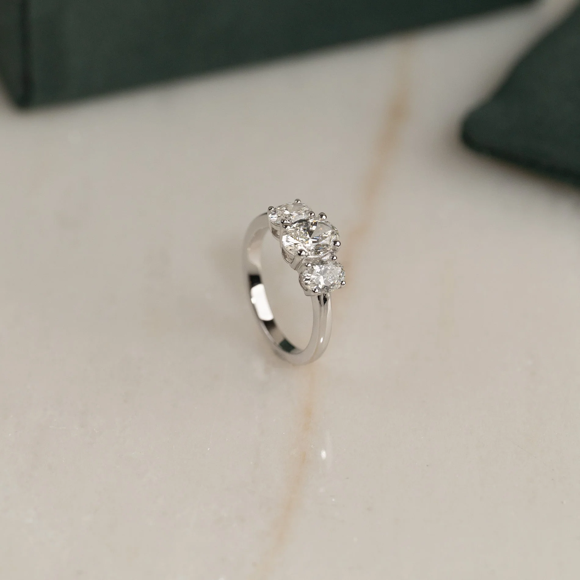 THREE-STONE OVAL-CUT DIAMOND RING